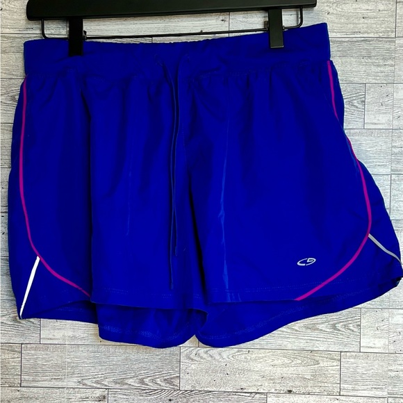 Royal Blue Running Shorts w/Pink Trim. Ladies- size L (has reflective markings) - Picture 6 of 11